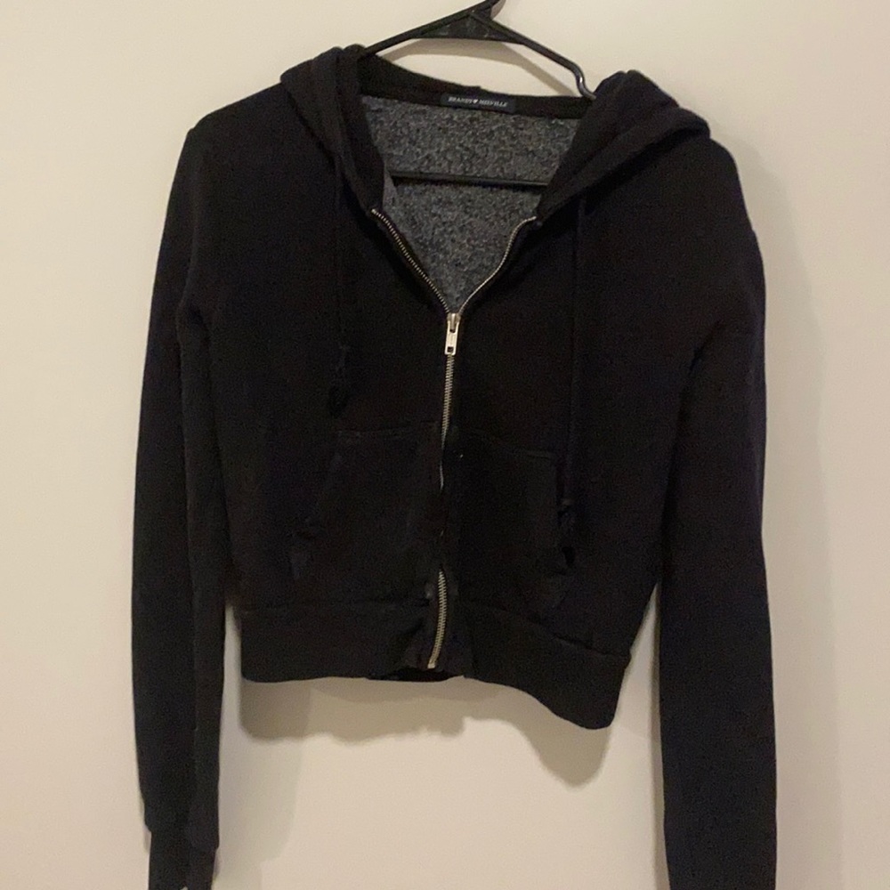 A one size black Brandy Melville zip up hoodie